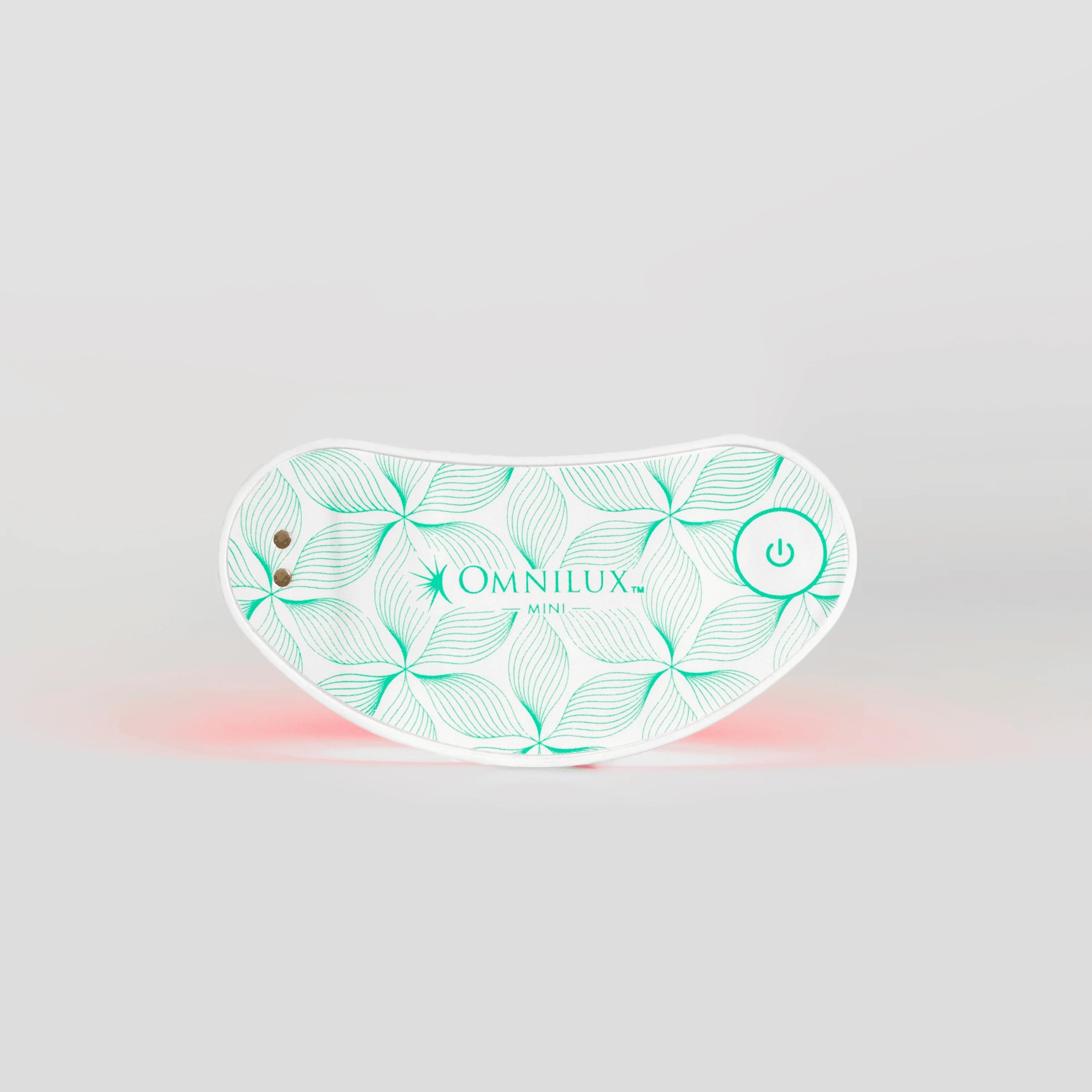 Omnilux LED eye device with a leaf pattern on a gray background